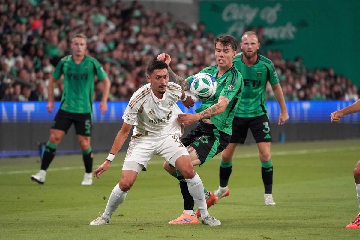 Nov 2, 2025; Austin, Texas, USA; LAFC midfielder Mark Delgado (8) moves the ball against Austin FC forward Robert Taylor (16) during the first half at Q2 Stadium. Mandatory Credit: Dustin Safranek-Imagn Images