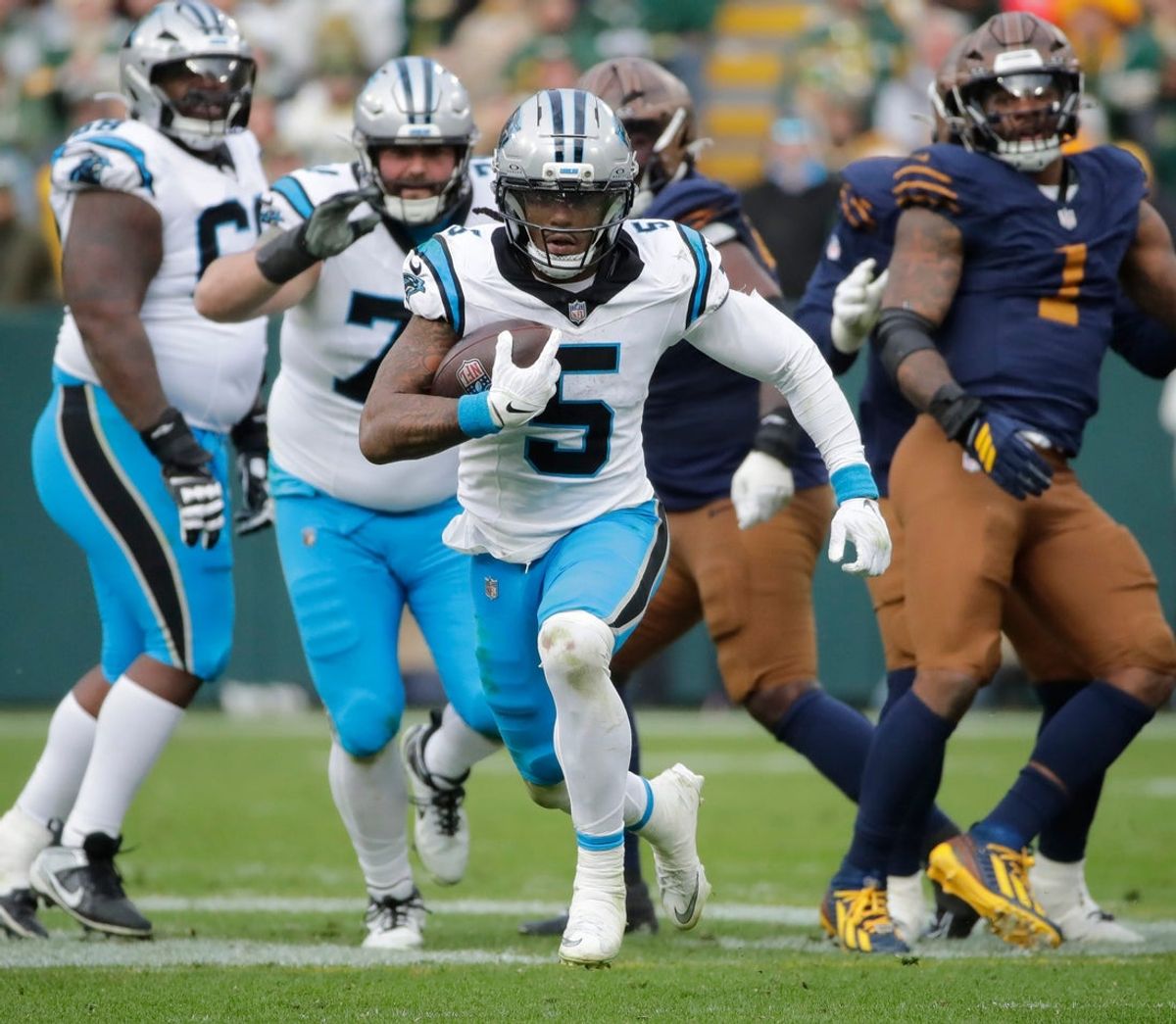 Carolina Panthers running back Rico Dowdle (5) breaks away for a long gain with less than a minute left in the game against the Green Bay Packers during their football game Sunday, November 2, 2025, at Lambeau Field in Green Bay, Wisconsin. Carolina won 16-13.