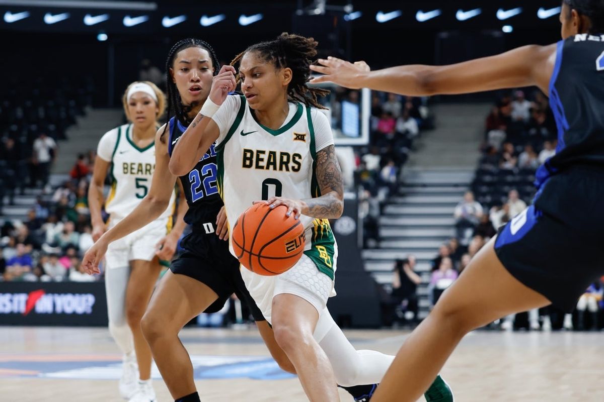 Nov 3, 2025; Paris, FRA;  Baylor Bears guard Taliah Scott (0) drives to the basket past Duke Blue Devils guard Taina Mair (22) during the second half at Adidas Arena. Mandatory Credit: Chris Jones-Imagn Images
