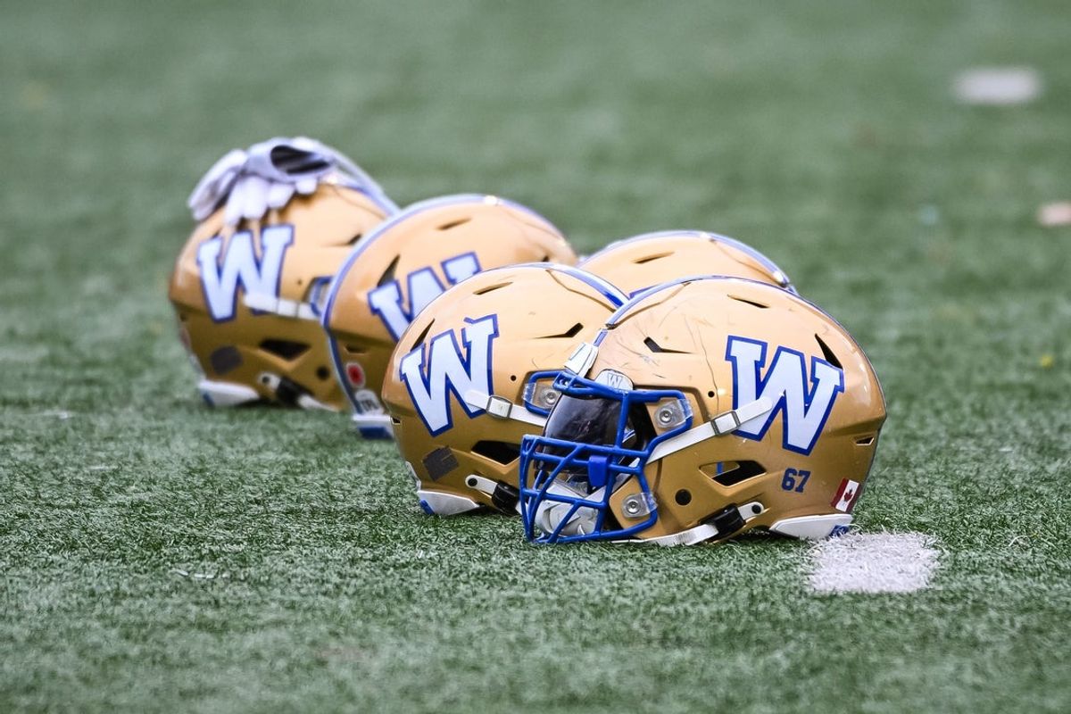 Nov 1, 2025; Montreal, Quebec, Canada; View of Winnipeg Blue Bombers helmets on the field during warm-up before the game against the against the Montreal Alouettes at Percival-Molson stadium. Mandatory Credit: David Kirouac-Imagn Images