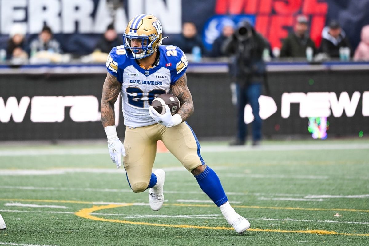 Nov 1, 2025; Montreal, Quebec, Canada; Winnipeg Blue Bombers running back Brady Oliveira (20) runs the ball against the Montreal Alouettes during the first quarter at Percival-Molson stadium. Mandatory Credit: David Kirouac-Imagn Images