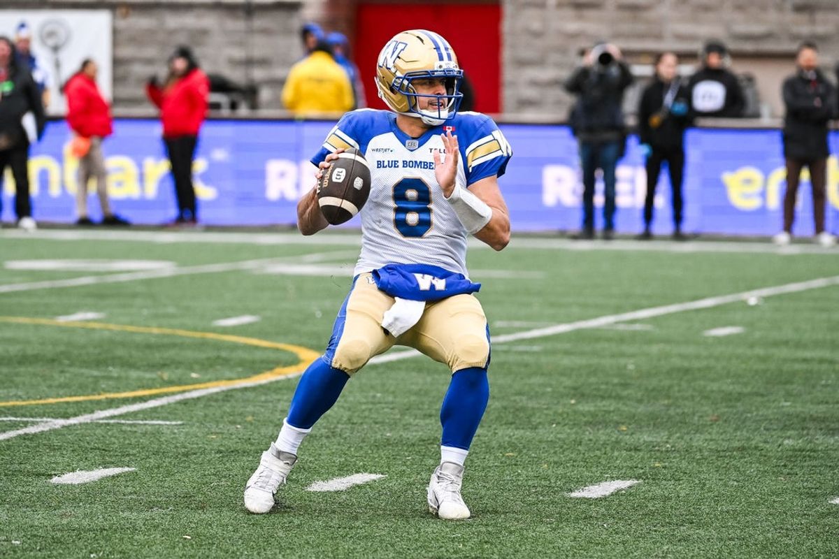 Nov 1, 2025; Montreal, Quebec, Canada; Winnipeg Blue Bombers quarterback Zach Collaros (8) gets ready to pass the ball against the Montreal Alouettes during the third quarter at Percival-Molson stadium. Mandatory Credit: David Kirouac-Imagn Images
