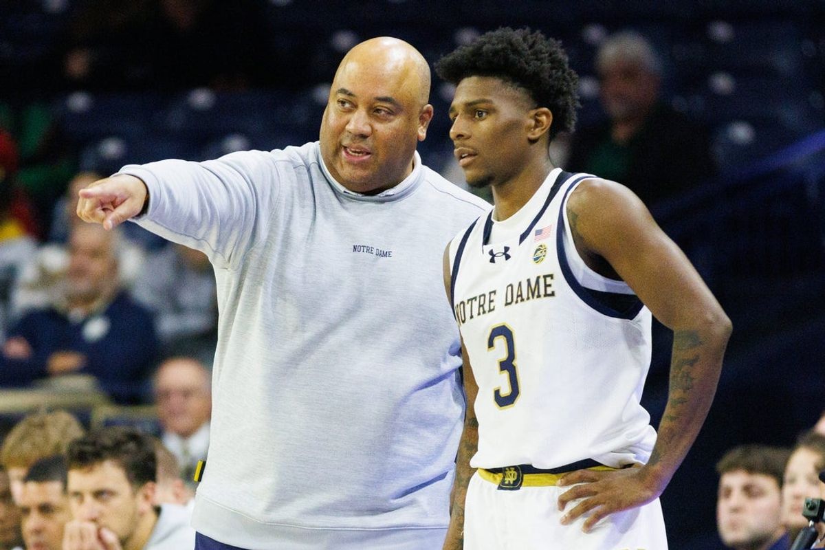 Notre Dame head coach Micah Shrewsberry, left, speaks with guard Markus Burton (3) during a NCAA basketball game against LIU Brooklyn at Purcell Pavilion on Monday, Nov. 3, 2025, in South Bend.