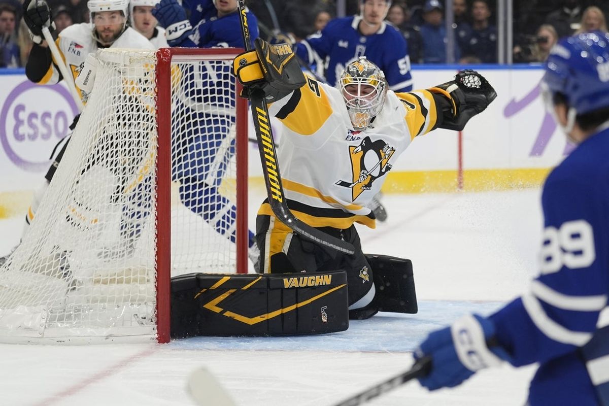 Nov 3, 2025; Toronto, Ontario, CAN; Pittsburgh Penguins goaltender Tristan Jarry (35) makes a save on Toronto Maple Leafs forward Nic Robertson (89) during the first period at Scotiabank Arena. Mandatory Credit: John E. Sokolowski-Imagn Images