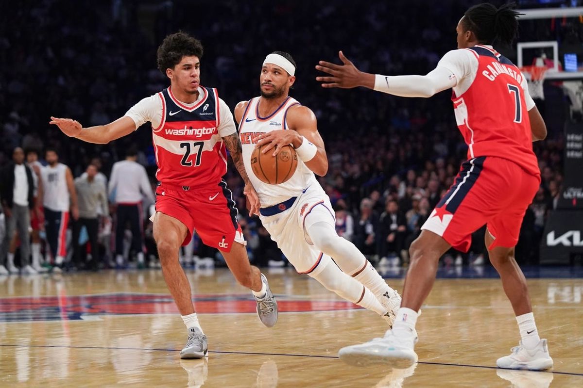 Nov 3, 2025; New York, New York, USA; New York Knicks guard Josh Hart (3) drives around Washington forward Will Riley (27) and Washington guard Bub Carrington (7) during the first half at Madison Square Garden. Mandatory Credit: Lucas Boland-Imagn Images