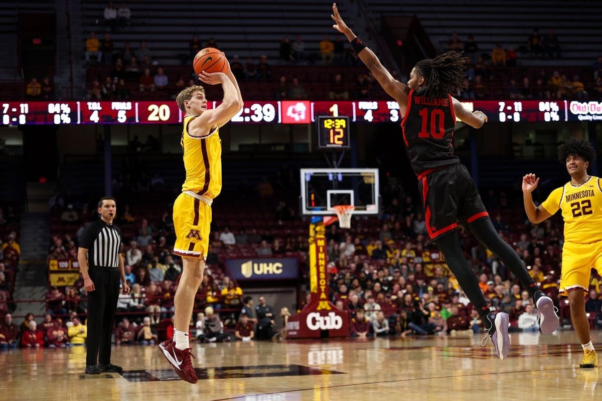 Nov 3, 2025; Minneapolis, Minnesota, USA; Minnesota Golden Gophers forward Cade Tyson (10) shoots as Gardner-Webb Runnin' Bulldogs guard Curtis Williams (10) defends during the first half at Williams Arena. Mandatory Credit: Matt Krohn-Imagn Images