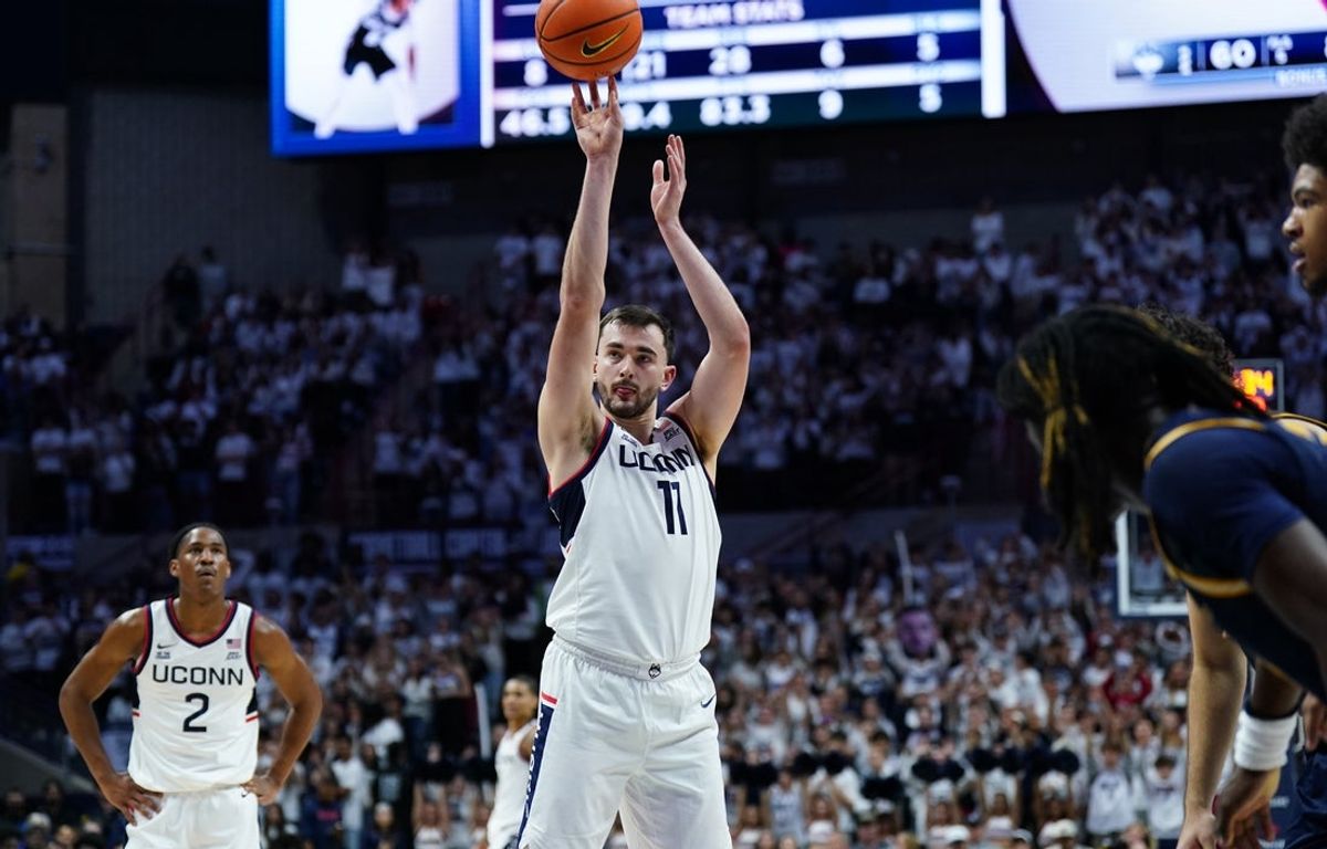 Nov 3, 2025; Storrs, Connecticut, USA; UConn Huskies forward Alex Karaban (11) shoots a free-throw against the New Haven Chargers in the second half at Harry A. Gampel Pavilion. Mandatory Credit: David Butler II-Imagn Images