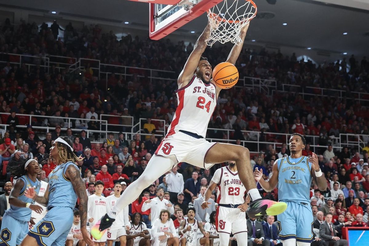 Nov 3, 2025; Queens, New York, USA;  St. John's Red Storm forward Zuby Ejiofor (24) dunks in the second half against the Quinnipiac Bobcats at Carnesecca Arena. Mandatory Credit: Wendell Cruz-Imagn Images