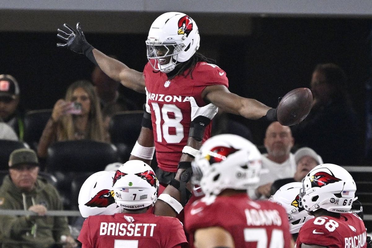 Nov 3, 2025; Arlington, Texas, USA; Arizona Cardinals wide receiver Marvin Harrison Jr. (18) celebrates with teammates after scoring a touchdown against the Dallas Cowboys in the first half at AT&T Stadium. Mandatory Credit: Jerome Miron-Imagn Images