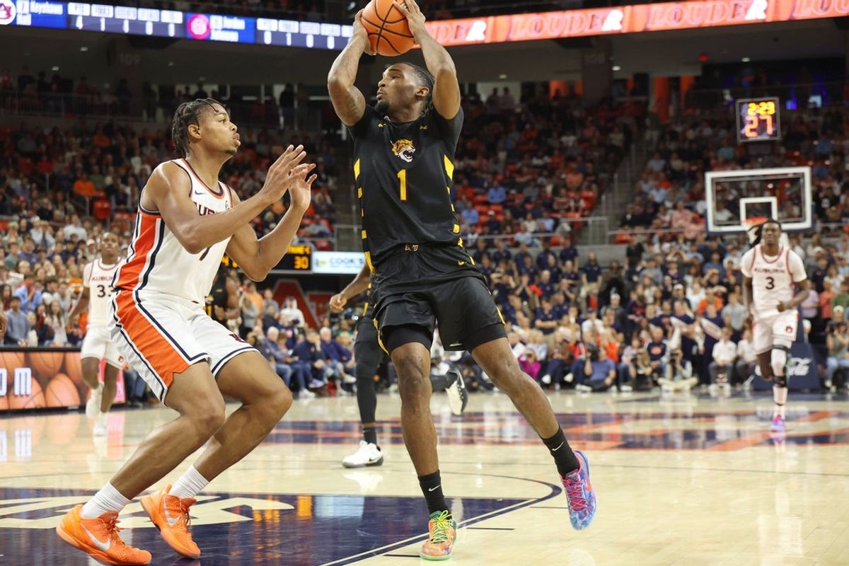 Nov 3, 2025; Auburn, Alabama, USA;  Bethune-Cookman Wildcats guard Arterio Morris (1) shoots over Auburn Tigers guard Keyshawn Hall (7) during the first half at Neville Arena. Mandatory Credit: John Reed-Imagn Images