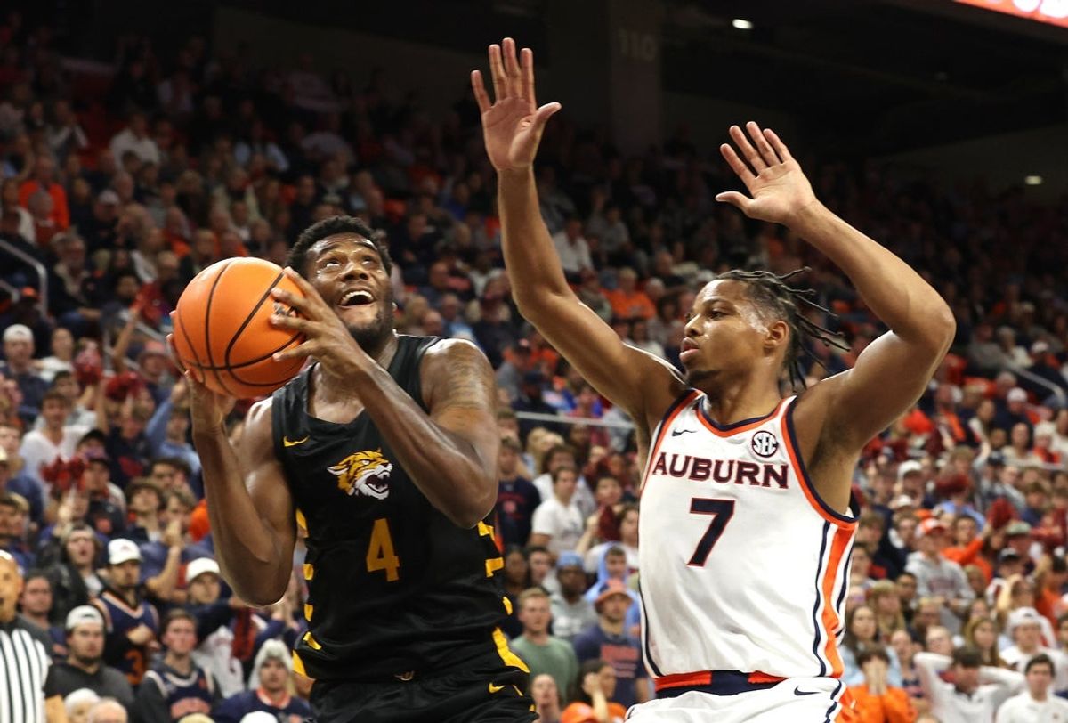 Nov 3, 2025; Auburn, Alabama, USA;  Bethune-Cookman Wildcats forward Ariel Bland (4) took for a shot as Auburn Tigers guard Keyshawn Hall (7) defends during the first half at Neville Arena. Mandatory Credit: John Reed-Imagn Images