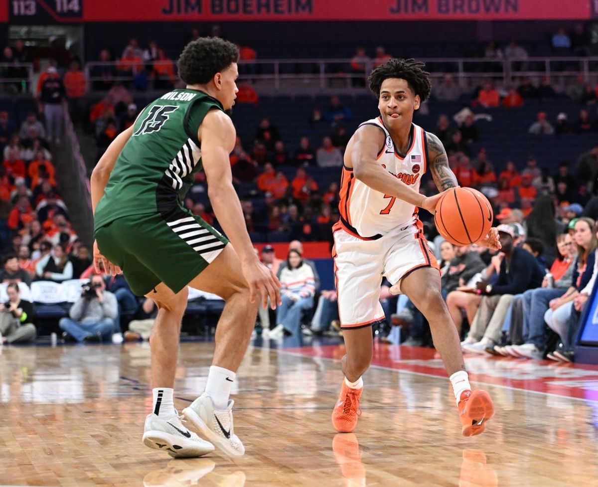 Nov 3, 2025; Syracuse, New York, USA; Syracuse Orange forward Kiyan Anthony (7) passes against Binghamton Bearcats guard Bryson Wilson (15) in the second half at the JMA Wireless Dome. Mandatory Credit: Mark Konezny-Imagn Images