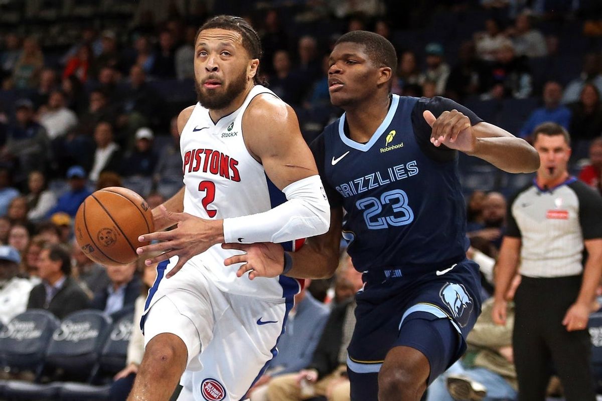 Nov 3, 2025; Memphis, Tennessee, USA; Detroit Pistons guard Cade Cunningham (2) drives to the basket as Memphis Grizzlies forward Cedric Coward (23) defends during the first quarter at FedExForum. Mandatory Credit: Petre Thomas-Imagn Images