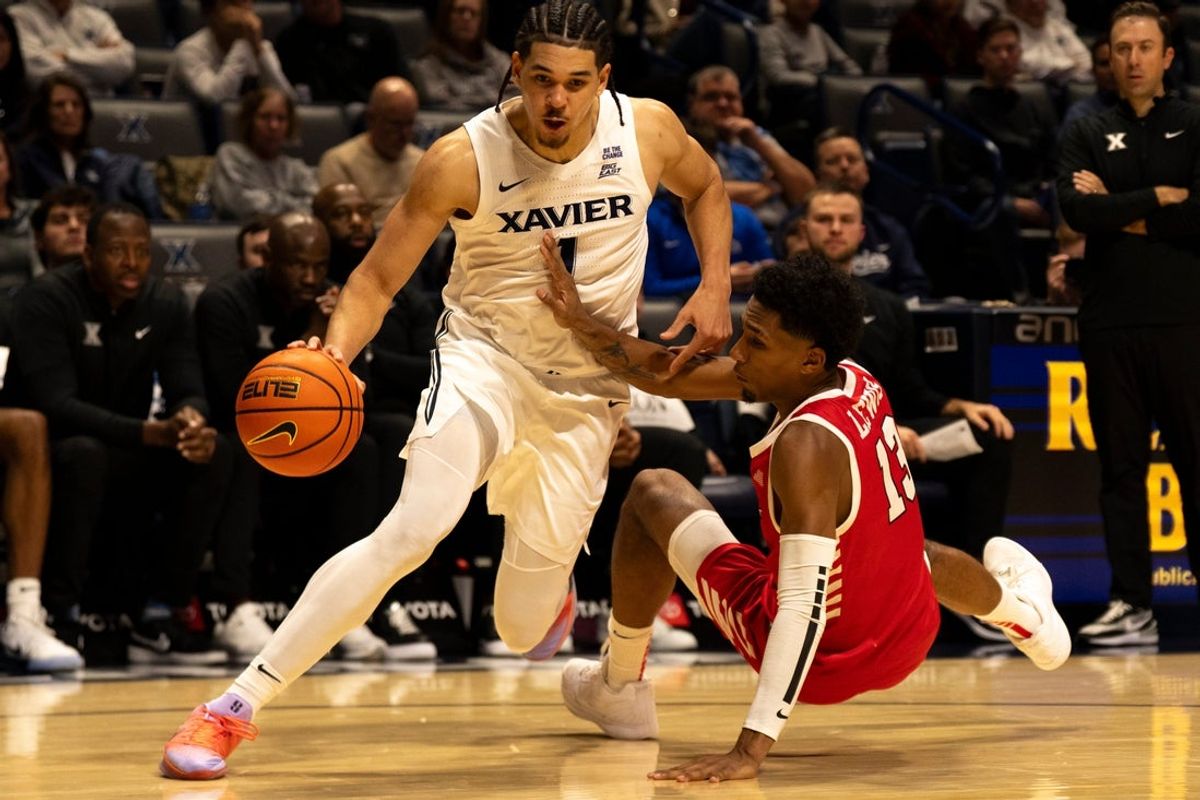 Xavier Musketeers guard Malik Messina-Moore (1) drives on Marist Red Foxes guard Elijah Lewis (13) in the second half of the basketball game at the Cintas Center on Nov. 3, 2025.