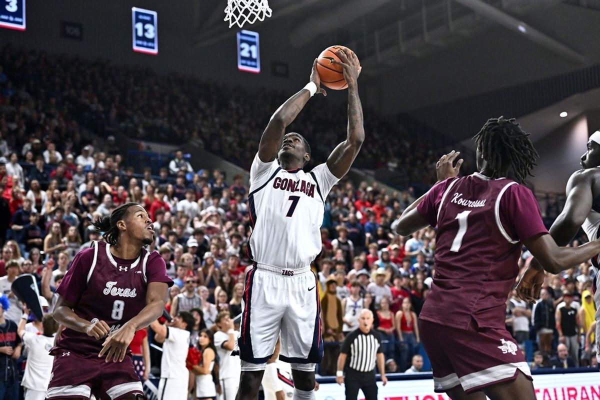 Nov 3, 2025; Spokane, Washington, USA; Gonzaga Bulldogs guard Tyon Grant-Foster (7) shoots against Texas Southern Tigers forward Anthony Andrews (8) in the first half at McCarthey Athletic Center. Mandatory Credit: James Snook-Imagn Images