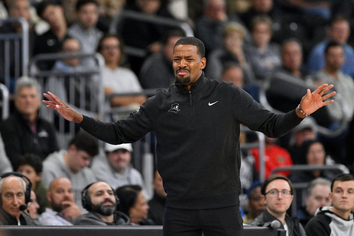 Nov 3, 2025; Providence, Rhode Island, USA; Providence Friars head coach Kim English reacts to the action on the court during the second half against the Holy Cross Crusaders at Amica Mutual Pavilion. Mandatory Credit: Eric Canha-Imagn Images
