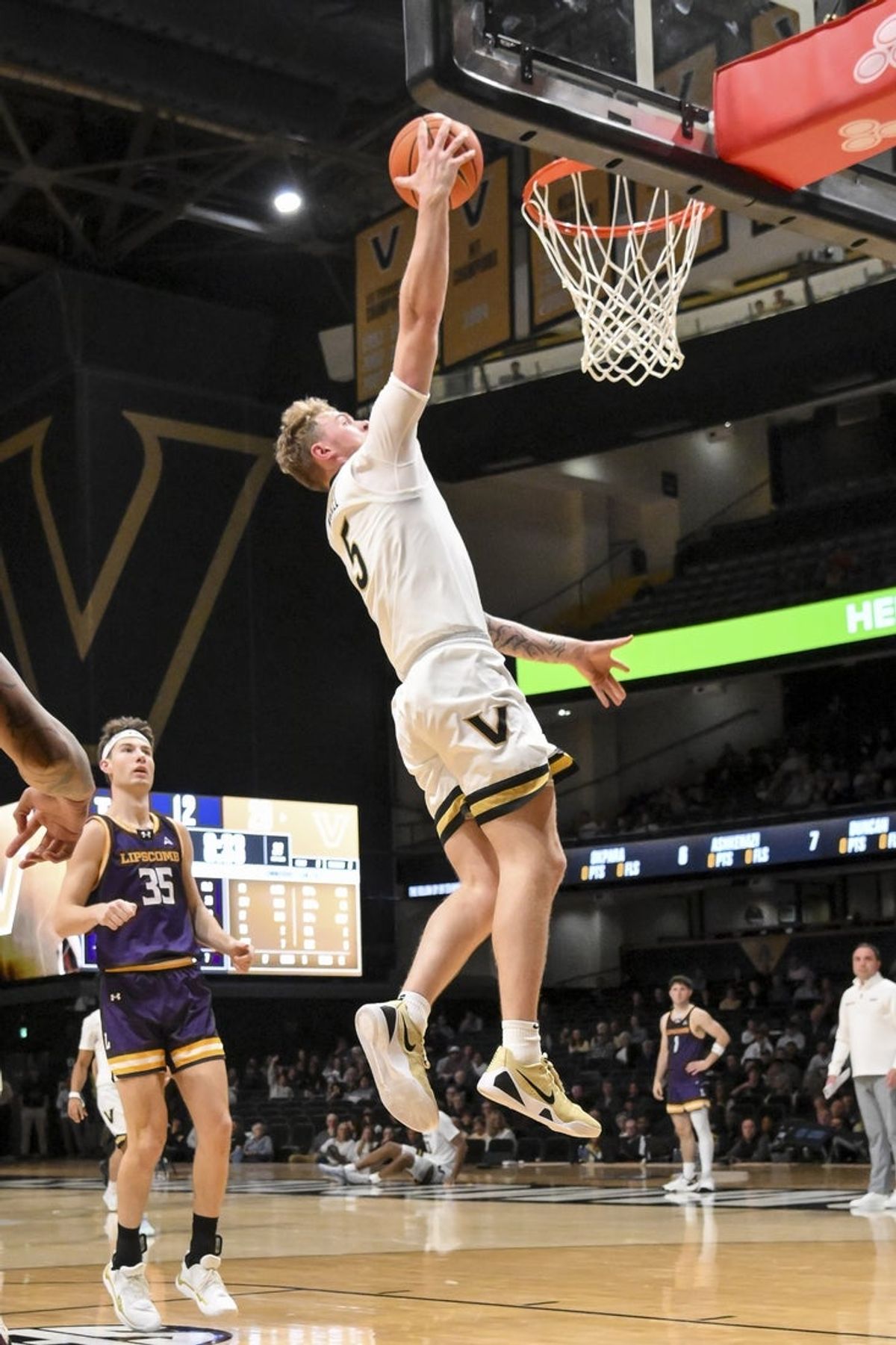 Nov 3, 2025; Nashville, Tennessee, USA;  Vanderbilt Commodores forward Tyler Nickel (5) dunks the ball against the Lipscomb Bisons during the first half at Memorial Gymnasium. Mandatory Credit: Steve Roberts-Imagn Images