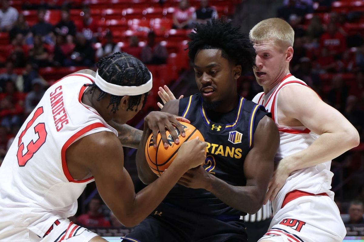 Nov 3, 2025; Salt Lake City, Utah, USA; San Jose State Spartans guard Javaughn Hannah (2) battles with Utah Utes forward Kendyl Sanders (13) and guard Jacob Patrick (6) for a loose ball during the first half at Jon M. Huntsman Center. Mandatory Credit: Rob Gray-Imagn Images