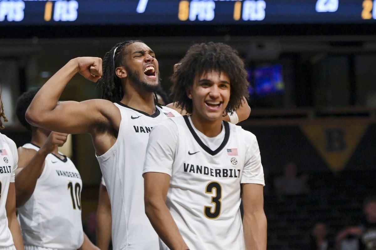 Nov 3, 2025; Nashville, Tennessee, USA;  Vanderbilt Commodores guard Tyler Tanner (3) and forward Devin McGlockton (99) celebrate a made basket plus the foul against the Lipscomb Bisons during the second half at Memorial Gymnasium. Mandatory Credit: Steve Roberts-Imagn Images