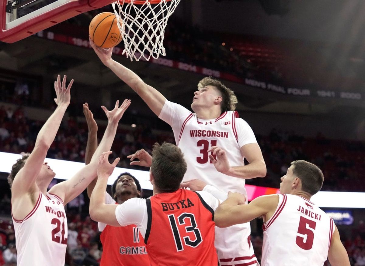 Wisconsin forward Nolan Winter (31) grabs a rebound during the first half of their game against Campbell Monday, November 3, 2025 at the Kohl Center in Madison, Wisconsin.