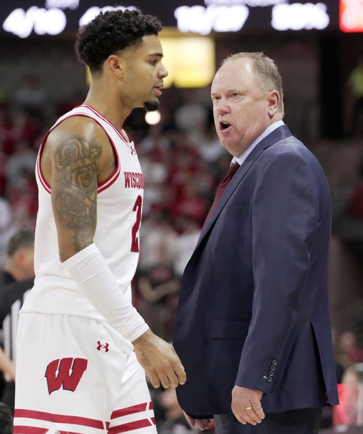 Wisconsin head coach Greg Gard talks with guard Nick Boyd (2) during the first half of their game against Campbell Monday, November 3, 2025 at the Kohl Center in Madison, Wisconsin.