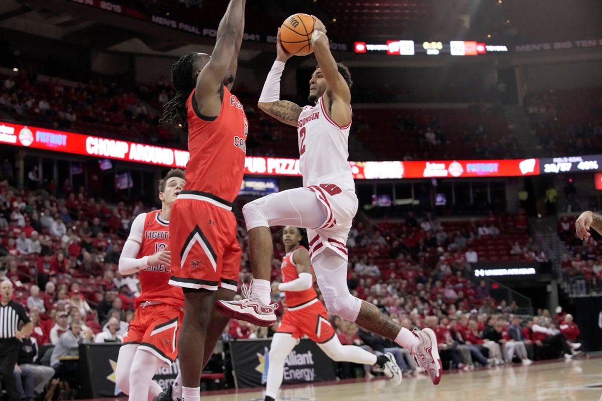 Wisconsin guard Nick Boyd (2) drives on Campbell guard Mutombo Kalambay (5) during the second half of their game Monday, November 3, 2025 at the Kohl Center in Madison, Wisconsin.