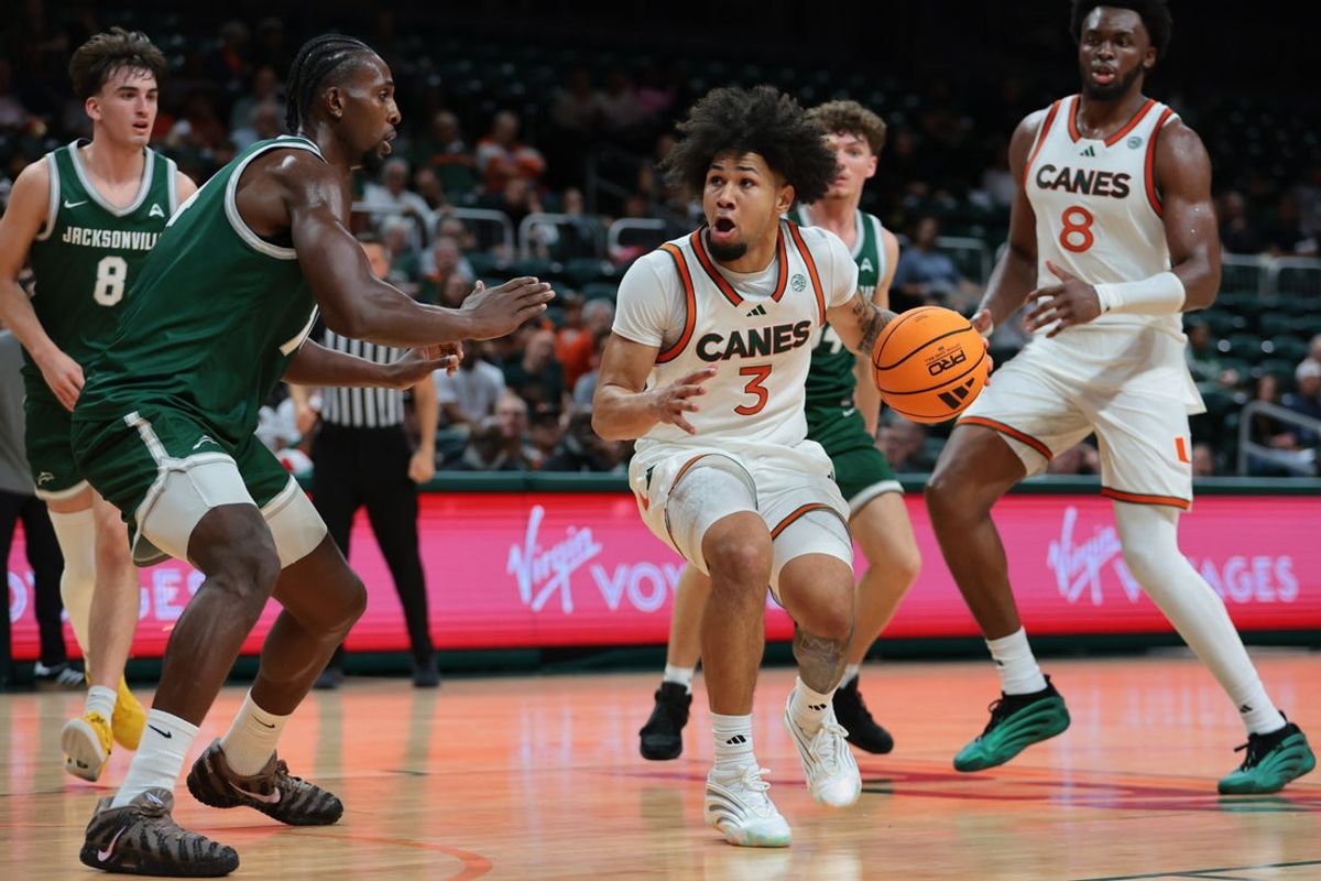 Nov 3, 2025; Coral Gables, Florida, USA; Miami Hurricanes guard Tre Donaldson (3) drives to the basket against the Jacksonville Dolphins during the second half at Watsco Center. Mandatory Credit: Sam Navarro-Imagn Images