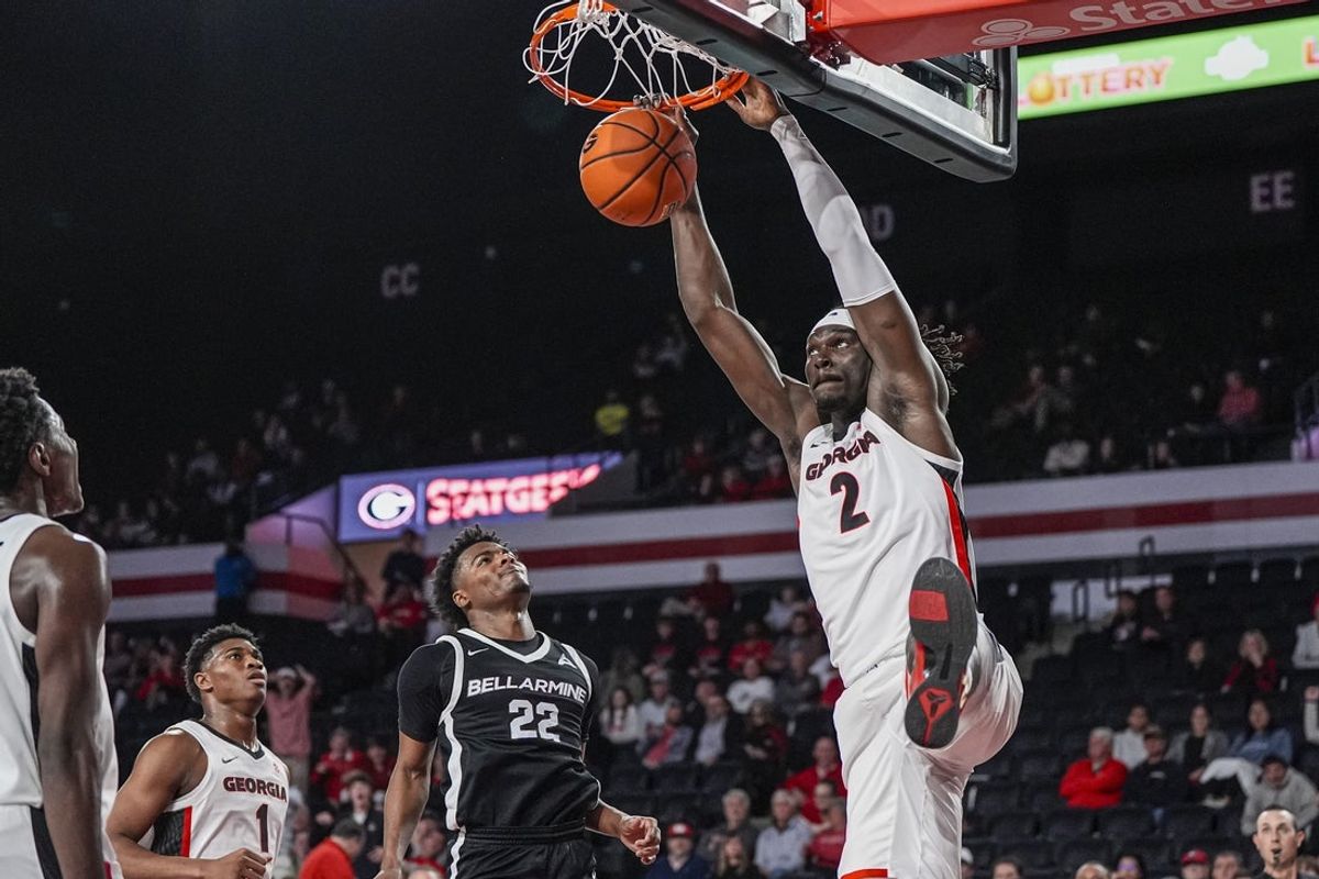 Nov 3, 2025; Athens, Georgia, USA; Georgia Bulldogs center Somto Cyril (2) dunks behind Bellarmine Knights guard Darrius Bolden (22) at Stegeman Coliseum. Mandatory Credit: Dale Zanine-Imagn Images