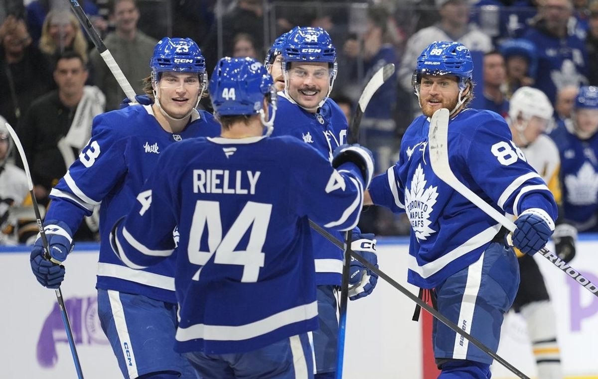 Nov 3, 2025; Toronto, Ontario, CAN; Toronto Maple Leafs defenseman Morgan Rielly (44), forward Matthew Knies (23) and forward Auston Matthews (34) congratulate forward William Nylander (88) after his second goal of the third period against the Pittsburgh Penguins at Scotiabank Arena. Mandatory Credit: John E. Sokolowski-Imagn Images