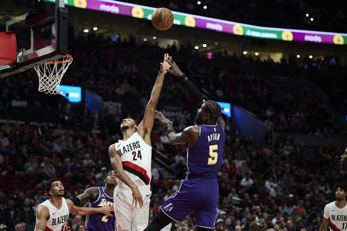 Nov 3, 2025; Portland, Oregon, USA; Los Angeles Lakers center Deandre Ayton (5) shoots a basket during the first half against Portland Trail Blazers forward Kris Murray (24) at Moda Center. Mandatory Credit: Troy Wayrynen-Imagn Images