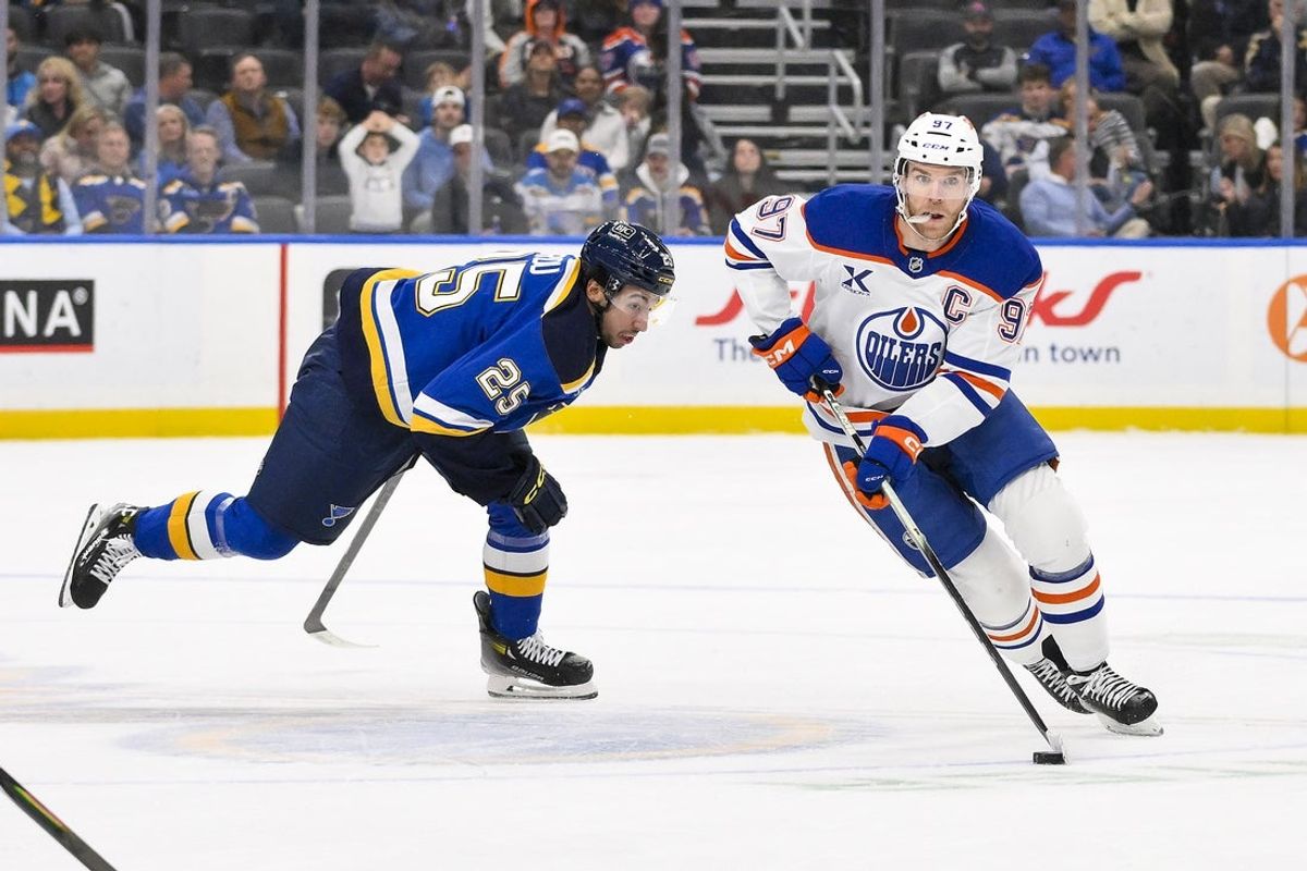Nov 3, 2025; St. Louis, Missouri, USA; Edmonton Oilers center Connor McDavid (97) controls the puck against the St. Louis Blues during the third period at Enterprise Center. Mandatory Credit: Jeff Curry-Imagn Images