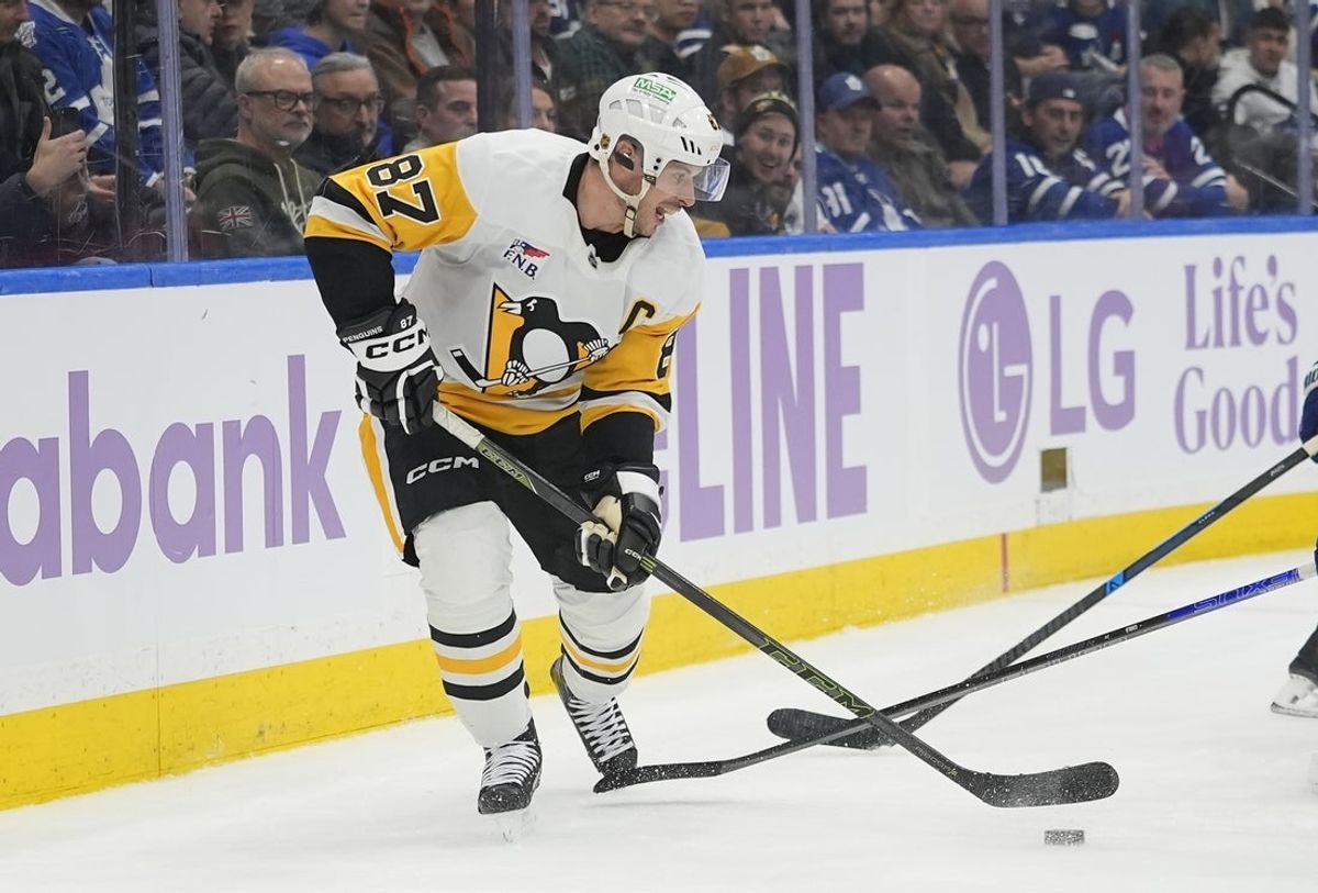 Nov 3, 2025; Toronto, Ontario, CAN; Pittsburgh Penguins forward Sidney Crosby (87) passes the puck against the Toronto Maple Leafs during the second period at Scotiabank Arena. Mandatory Credit: John E. Sokolowski-Imagn Images