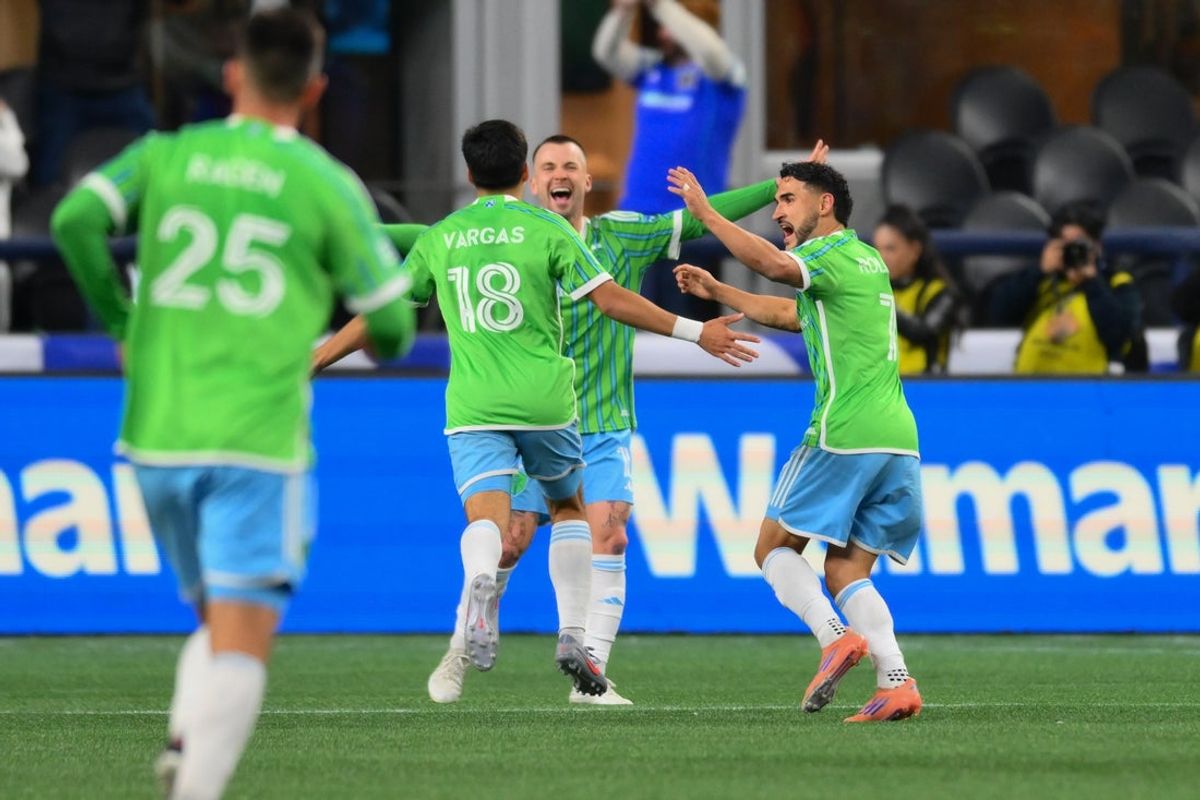 Nov 3, 2025; Seattle, Washington, USA; Seattle Sounders FC midfielder Obed Vargas (18) and midfielder Albert Rusnak (11) and midfielder Cristian Roldan (7) celebrate after a goal scored by Vargas against the Minnesota United during the second half at Lumen Field. Mandatory Credit: Steven Bisig-Imagn Images