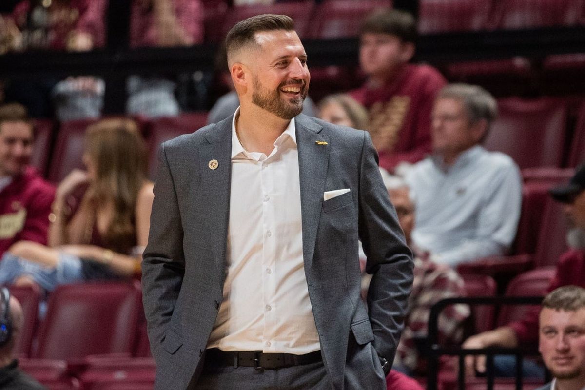 Florida State Seminoles head coach Luke Loucks smiles as his players celebrate. The Florida State Seminoles defeated the Alcorn State Braves 108-76 on Tuesday, Nov. 4, 2025.