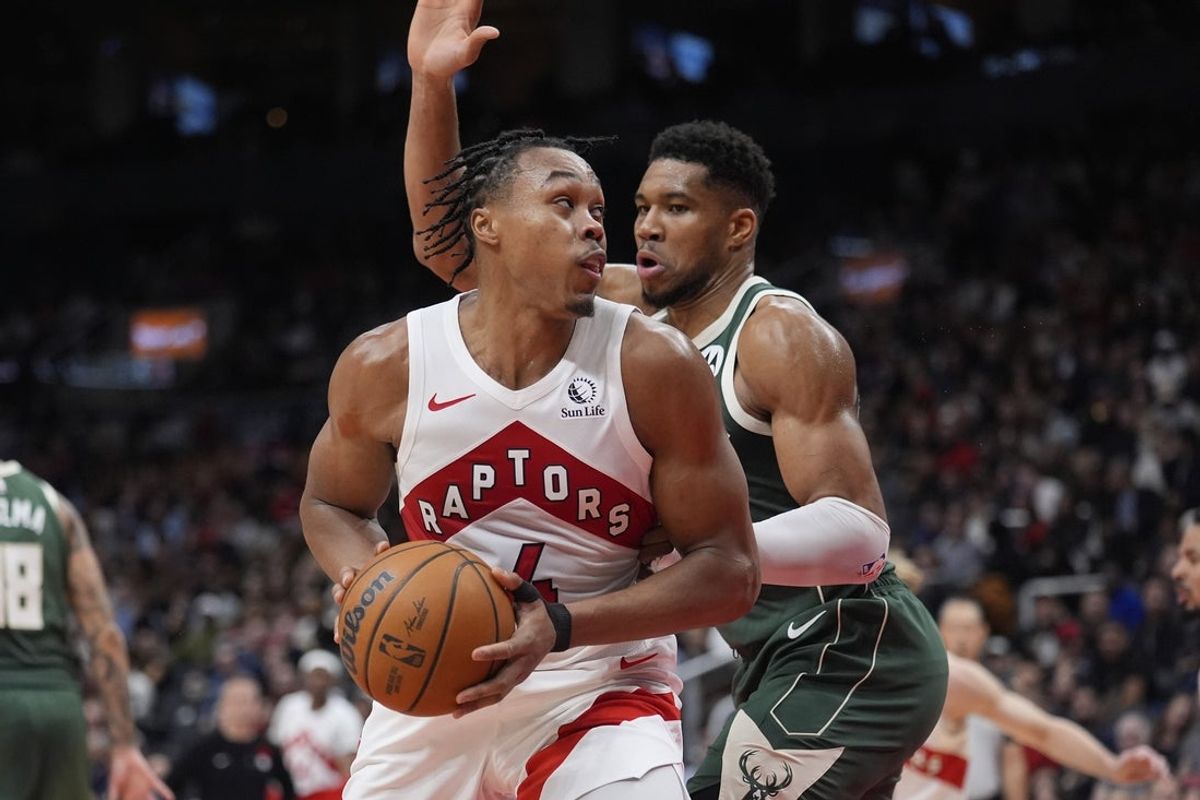 Nov 4, 2025; Toronto, Ontario, CAN; Toronto Raptors guard Scottie Barnes (4) controls the ball against Milwaukee Bucks forward Giannis Antetokounmpo (34) during the second half at Scotiabank Arena. Mandatory Credit: John E. Sokolowski-Imagn Images