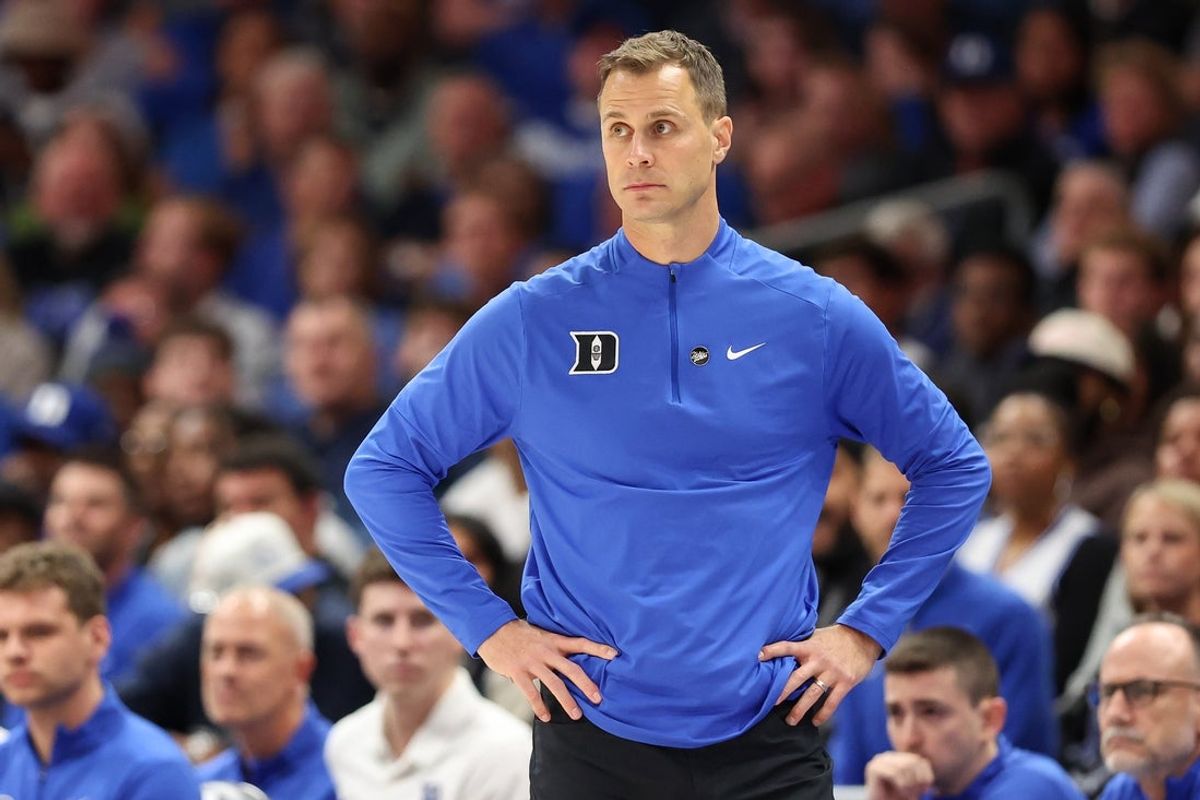 Nov 4, 2025; Charlotte, North Carolina, USA; Duke Blue Devils head coach Jon Scheyer watches the play against the Texas Longhorns during the first half of the Dick Vitale’s Invitational game at Spectrum Center. Mandatory Credit: Cory Knowlton-Imagn Images