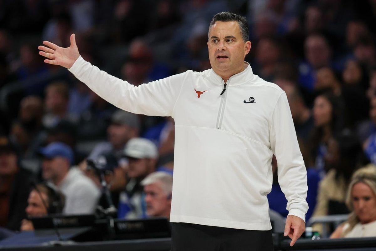 Nov 4, 2025; Charlotte, North Carolina, USA; Texas Longhorns head coach Sean Miller reacts to a play against the Duke Blue Devils during the first half of the Dick Vitale’s Invitational game at Spectrum Center. Mandatory Credit: Cory Knowlton-Imagn Images
