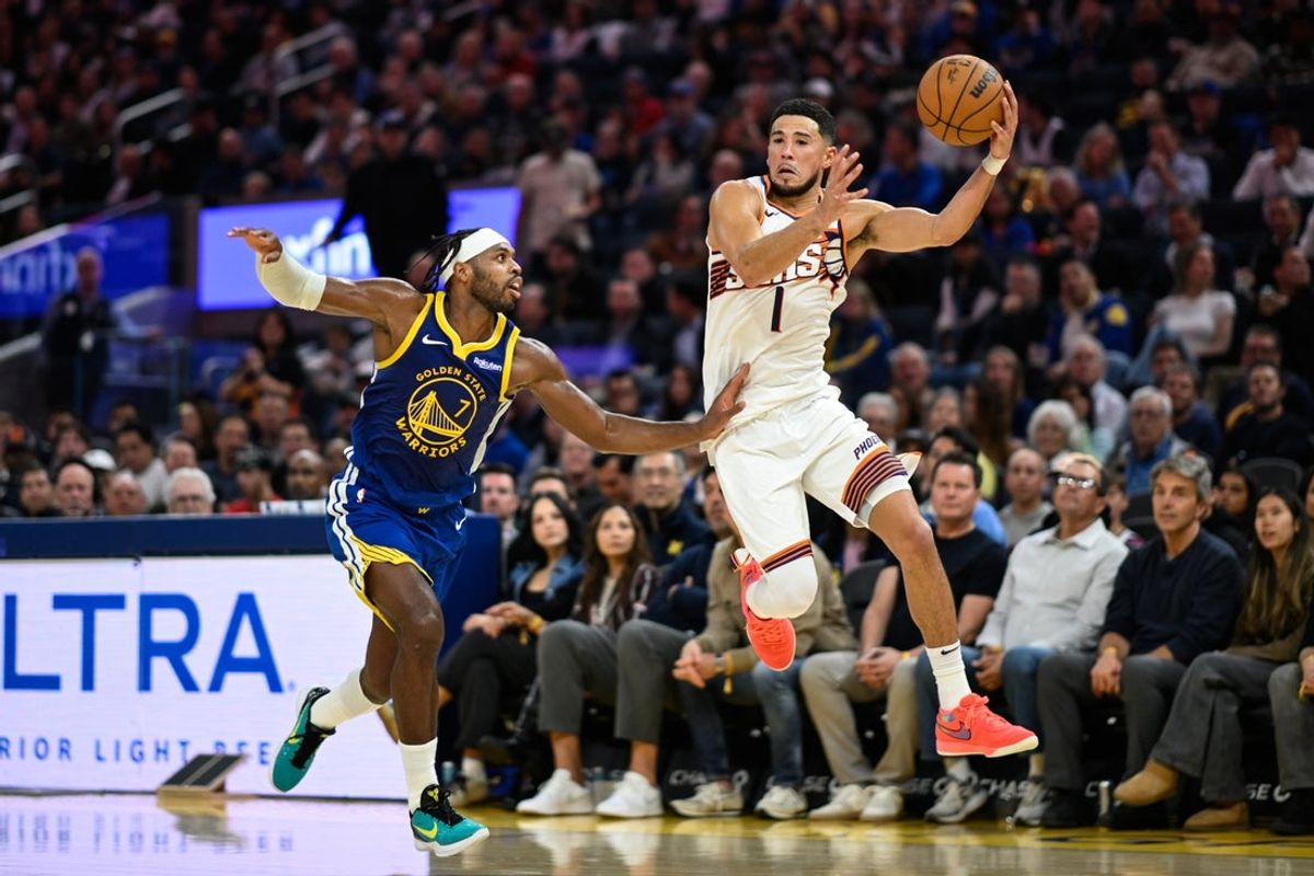 Nov 4, 2025; San Francisco, California, USA; Phoenix Suns guard Devin Booker (1) catches a pass against Golden State Warriors guard Buddy Hield (7) in the second quarter at Chase Center. Mandatory Credit: Eakin Howard-Imagn Images