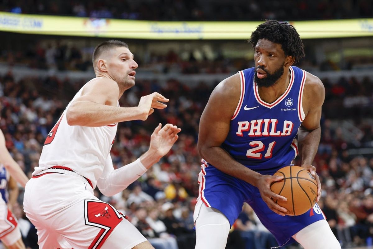 Nov 4, 2025; Chicago, Illinois, USA; Chicago Bulls center Nikola Vucevic (9) defends against Philadelphia 76ers center Joel Embiid (21) during the second half at United Center. Mandatory Credit: Kamil Krzaczynski-Imagn Images