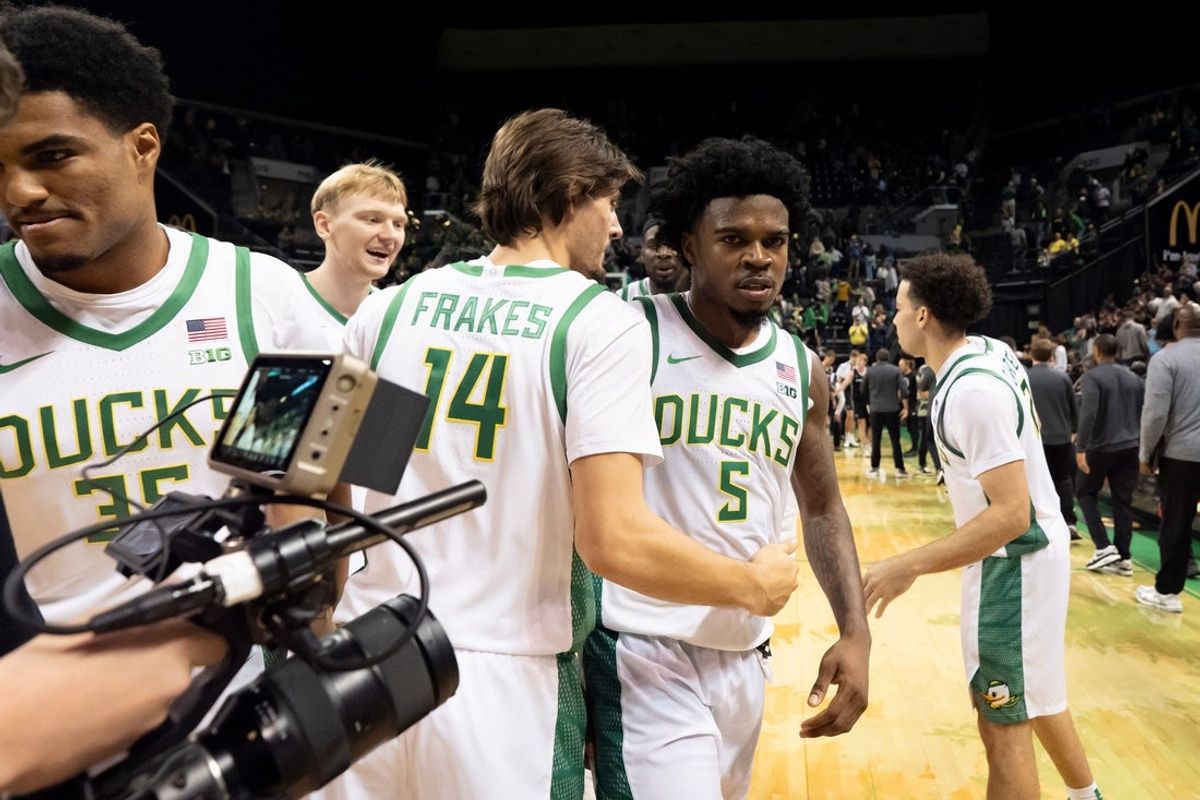 Players celebrate Oregon guard Takai Simpkins after the game as the Oregon Ducks host the Hawaii Rainbow Warriors on Nov. 4, 2025, at Matthew Knight Arena in Eugene, Oregon.