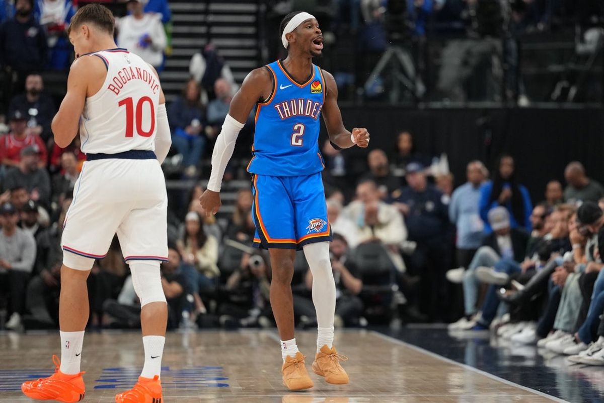 Nov 4, 2025; Inglewood, California, USA; Oklahoma City Thunder guard Shai Gilgeous-Alexander (2) celebrates as LA Clippers guard Bogdan Bogdanovic (10) watches in the second half at Intuit Dome. Mandatory Credit: Kirby Lee-Imagn Images