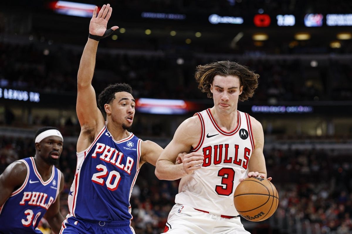 Nov 4, 2025; Chicago, Illinois, USA; Chicago Bulls guard Josh Giddey (3) drives to the basket against Philadelphia 76ers guard Jared McCain (20) during the first half at United Center. Mandatory Credit: Kamil Krzaczynski-Imagn Images