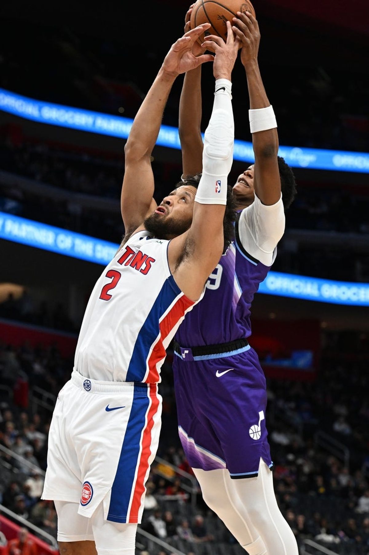 Nov 5, 2025; Detroit, Michigan, USA;  Detroit Pistons guard Cade Cunningham (2) battles for a rebound with Utah Jazz guard Ace Bailey (19) in the first quarter at Little Caesars Arena. Mandatory Credit: Lon Horwedel-Imagn Images