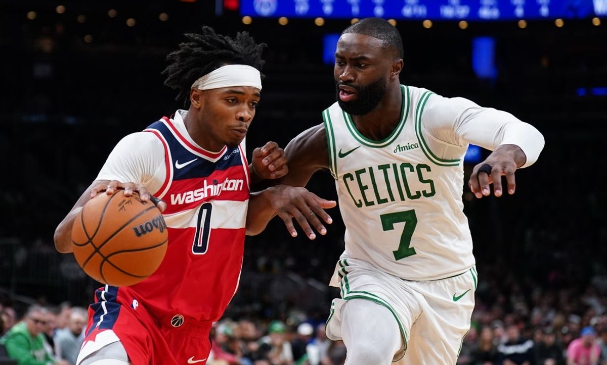 Nov 5, 2025; Boston, Massachusetts, USA; Washington Wizards guard Bilal Coulibaly (0) drive the ball against Boston Celtics guard/forward Jaylen Brown (7) in the second quarter at TD Garden. Mandatory Credit: David Butler II-Imagn Images
