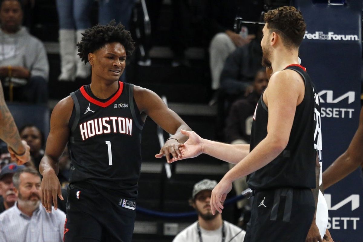 Nov 5, 2025; Memphis, Tennessee, USA; Houston Rockets guard Amen Thompson (1) reacts with center Alperen Sengun (28) during the first quarter against the Memphis Grizzlies at FedExForum. Mandatory Credit: Petre Thomas-Imagn Images