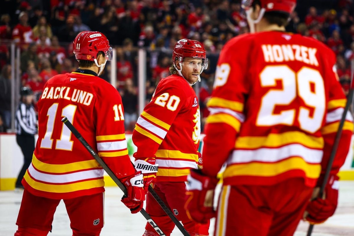 Nov 5, 2025; Calgary, Alberta, CAN; Calgary Flames left wing Blake Coleman (20) celebrates his goal with teammates against the Columbus Blue Jackets during the first period at Scotiabank Saddledome. Mandatory Credit: Sergei Belski-Imagn Images