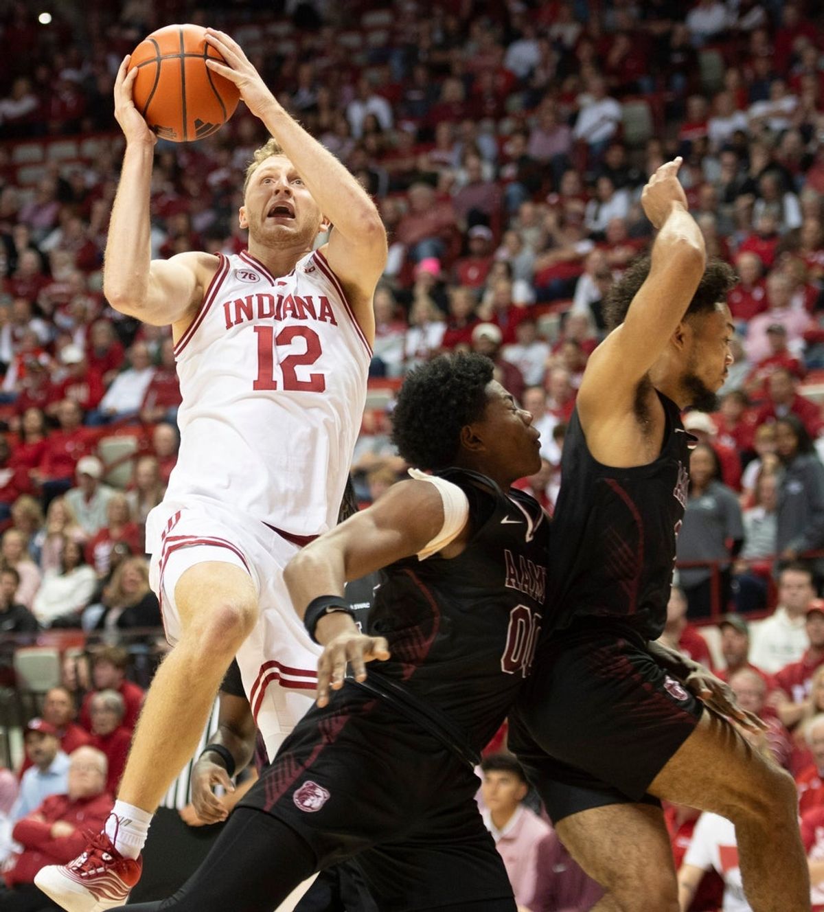 Indiana's Tucker DeVries (12) scores during the Indiana versus Alabama A&M men's basketball game at Simon Skjodt Assembly Hall on Wednesday, Nov. 5, 2025.