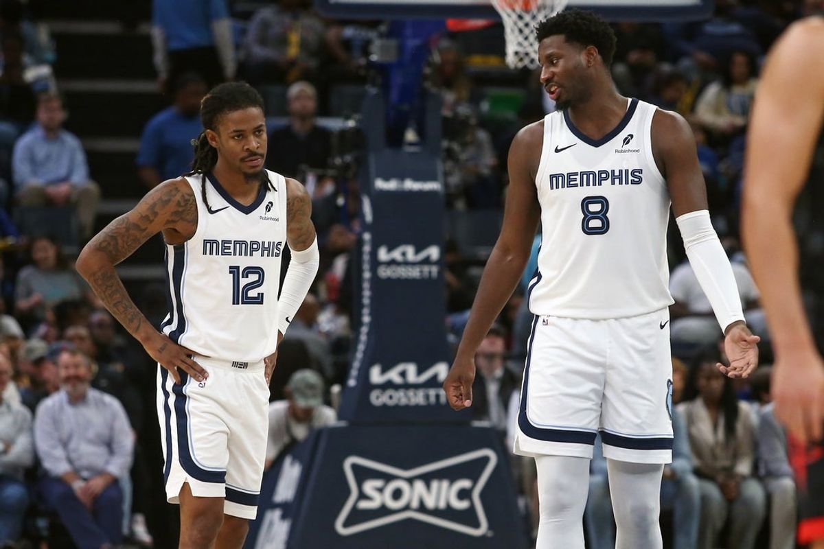 Nov 5, 2025; Memphis, Tennessee, USA; Memphis Grizzlies forward/center Jaren Jackson Jr. (8) talks with guard Ja Morant (12) during the second quarter against the Houston Rockets at FedExForum. Mandatory Credit: Petre Thomas-Imagn Images