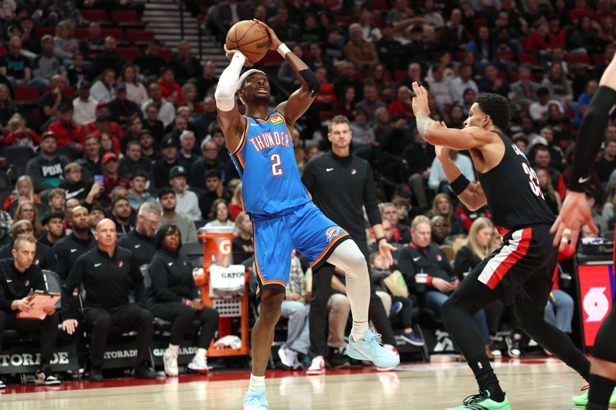 Nov 5, 2025; Portland, Oregon, USA;  Oklahoma City Thunder guard Shai Gilgeous-Alexander (2) shoots the ball over Portland Trail Blazers forward Toumani Camara (33) during the first half at Moda Center. Mandatory Credit: Jaime Valdez-Imagn Images