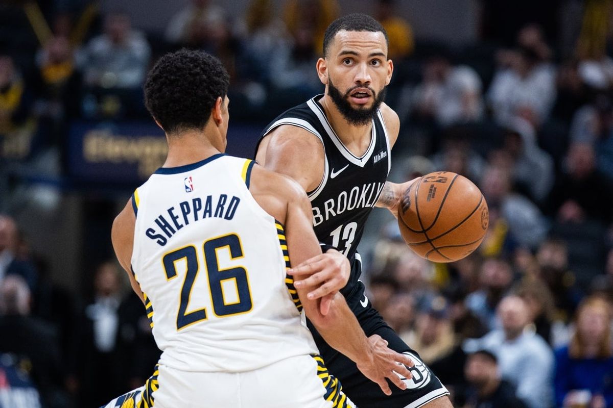 Nov 5, 2025; Indianapolis, Indiana, USA; Brooklyn Nets forward Tyrese Martin (13) dribbles the ball while Indiana Pacers guard Ben Sheppard (26)  defends in the second half  at Gainbridge Fieldhouse. Mandatory Credit: Trevor Ruszkowski-Imagn Images